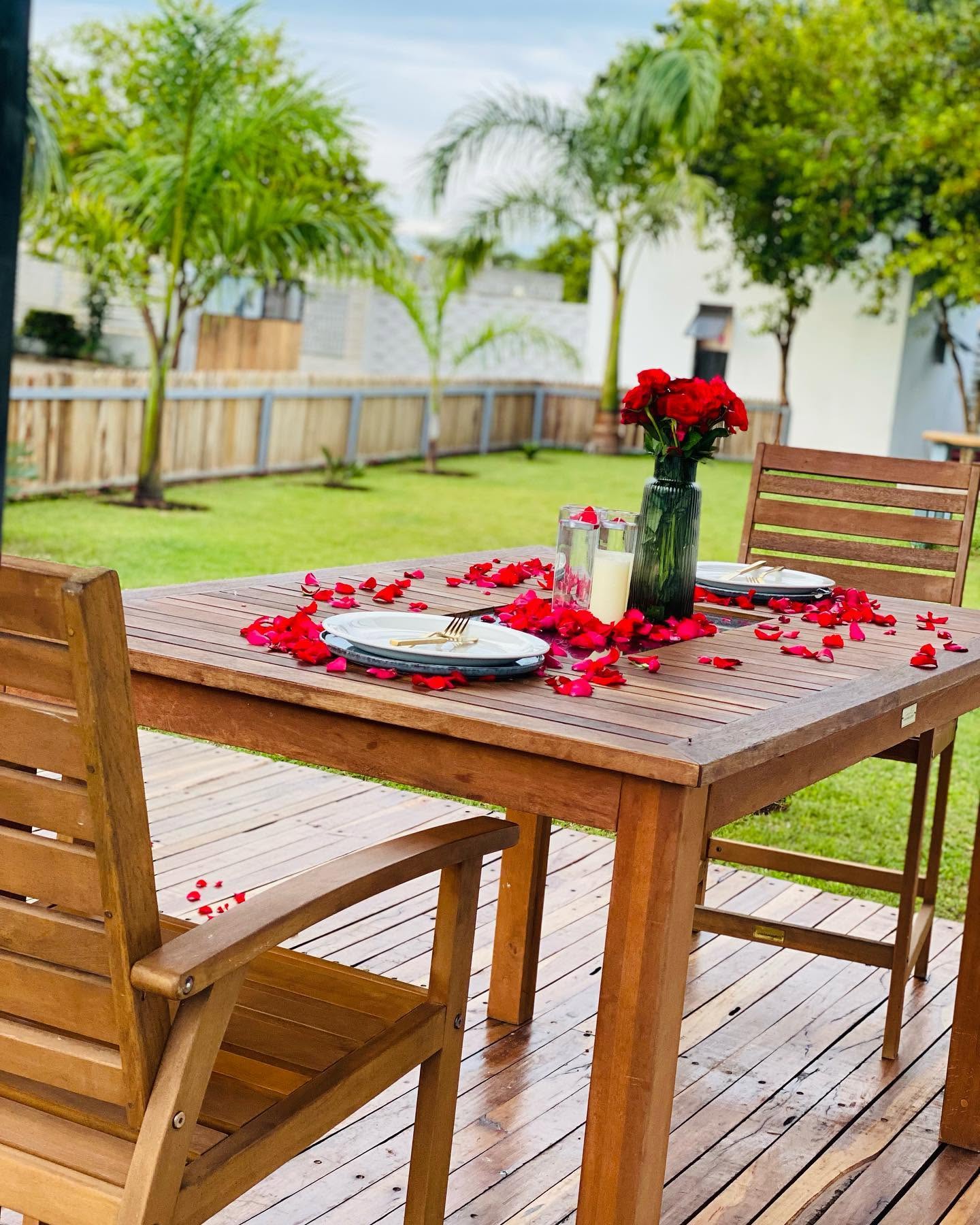 A garden table set with roses